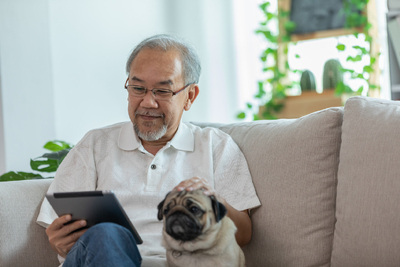 Man Using Tablet at Home 400w