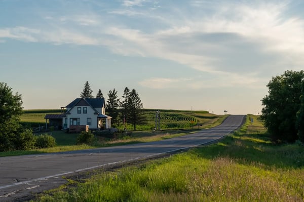 Farmhouse alongside rural road connected with fixed wireless - photo