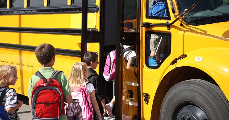 Children boarding connected school bus