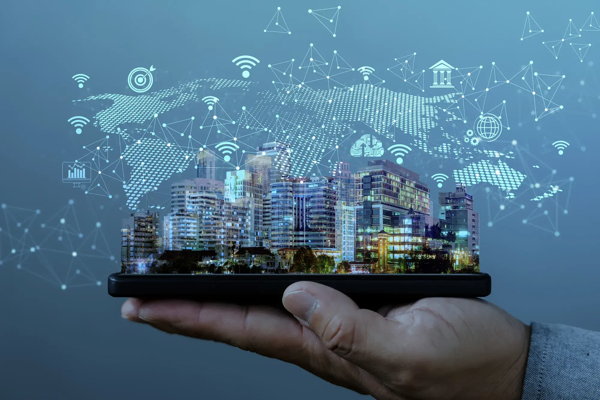 Hand holding smart city on tablet computer - photo with graphics