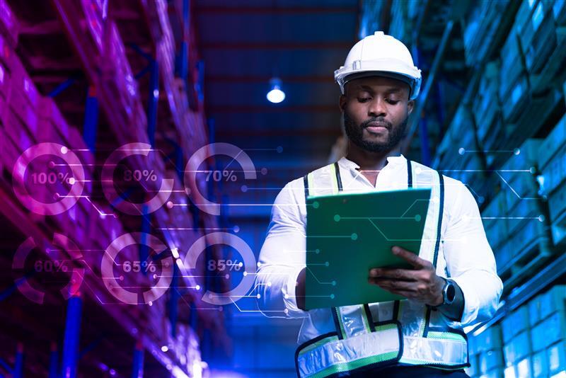 Man with wireless tablet in network server room - photo with graphics
