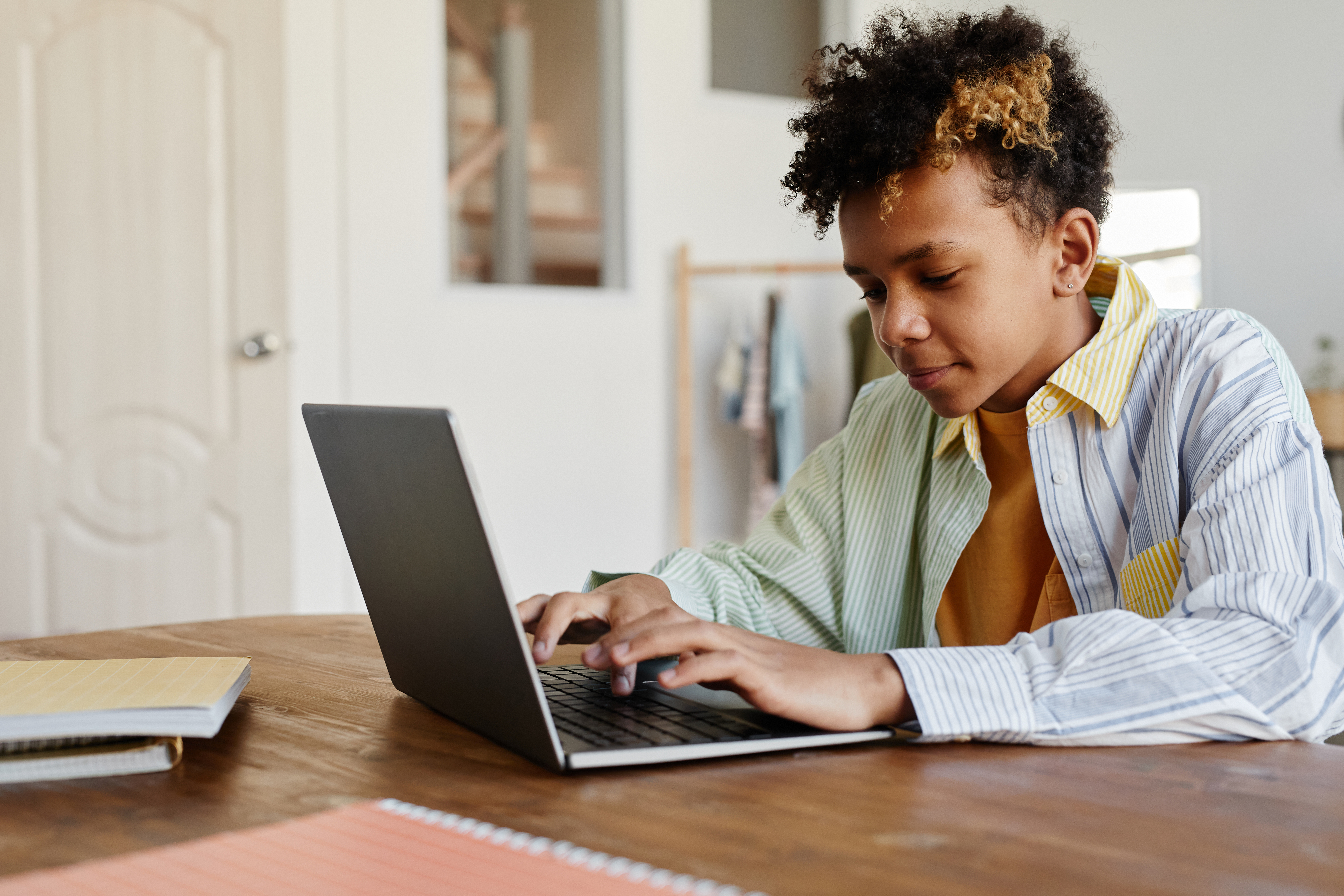 Student doing homework on a laptop